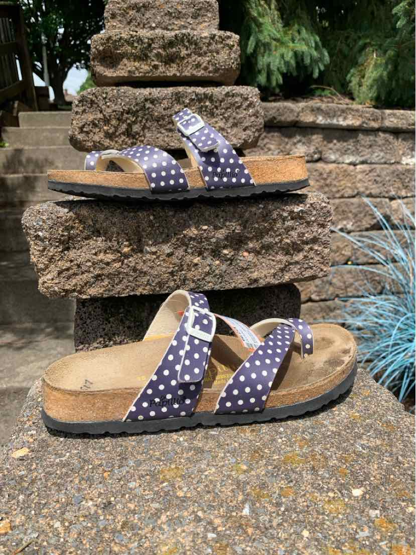 Women's size 38 sandal with cork footbed, navy blue straps featuring white polka dots, and adjustable buckles.