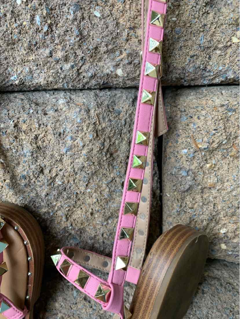 Pink leather wedge sandal with gold pyramid studs and wooden sole, size 8.5.