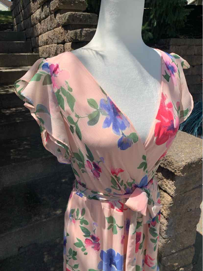 Light pink floral dress with V-neck, flutter sleeves, and a waist tie belt.