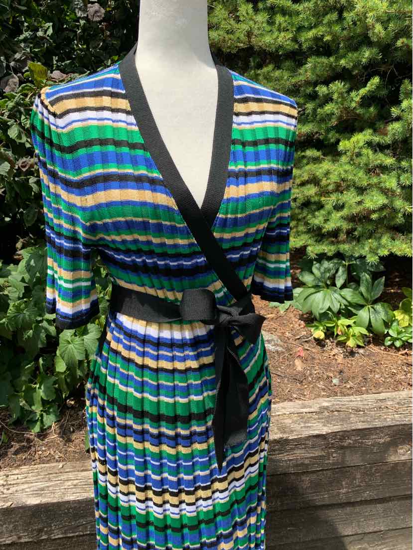 Striped wrap dress in blue, green, black, and white with three-quarter sleeves and black trim waistband.