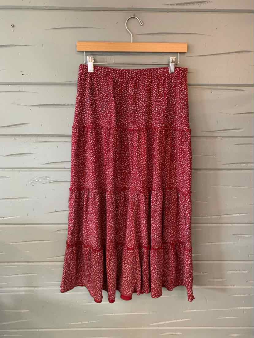 Red floral-print tiered maxi skirt with a gathered waist and flowing hem.