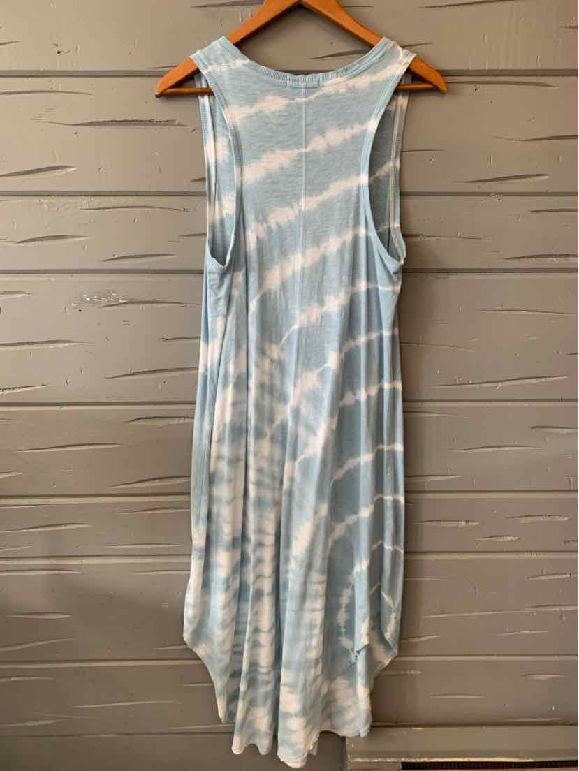 Light blue and white tie-dyed sleeveless dress with a loose fit and scooped armholes hanging on a wooden hanger.
