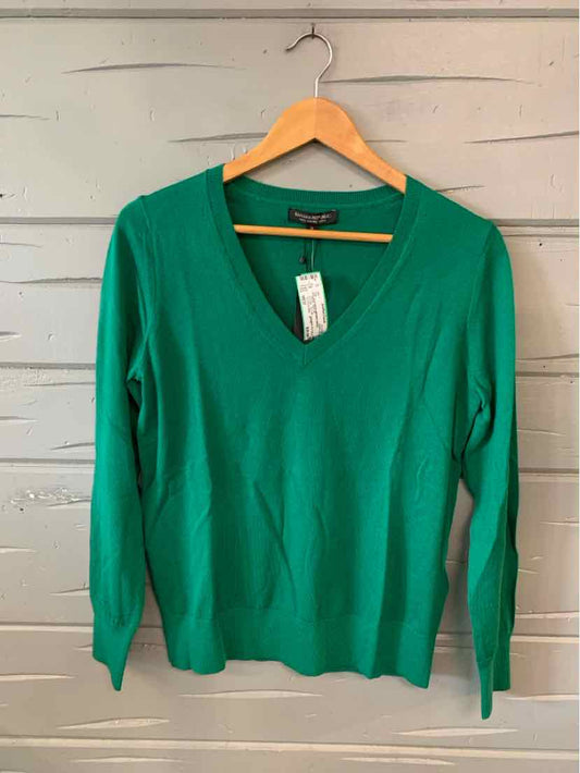 Green long-sleeve V-neck sweater with ribbed cuffs and hem, medium size.