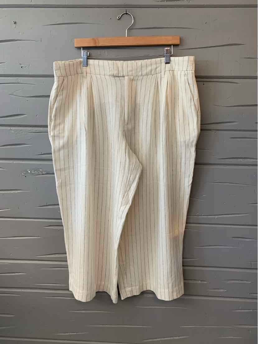Wide-leg pants in cream with vertical beige stripes, elastic waistband, and cropped length.