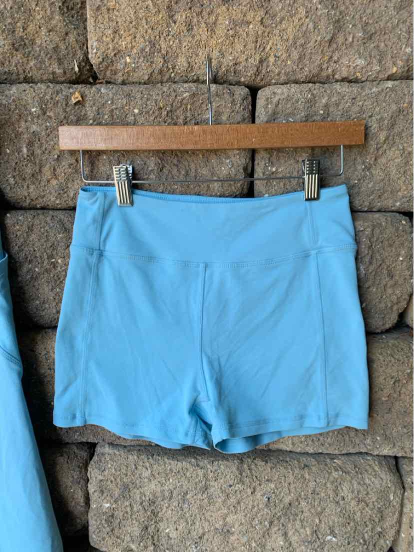 Light blue athletic shorts with a smooth fabric and fitted waistband, size small.