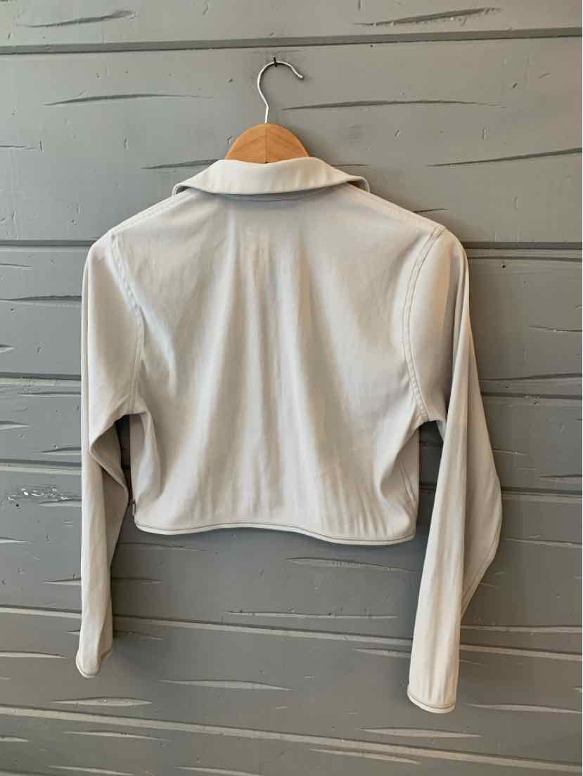 Beige cropped long-sleeve jacket with collar and zip-up front, lightweight fabric.