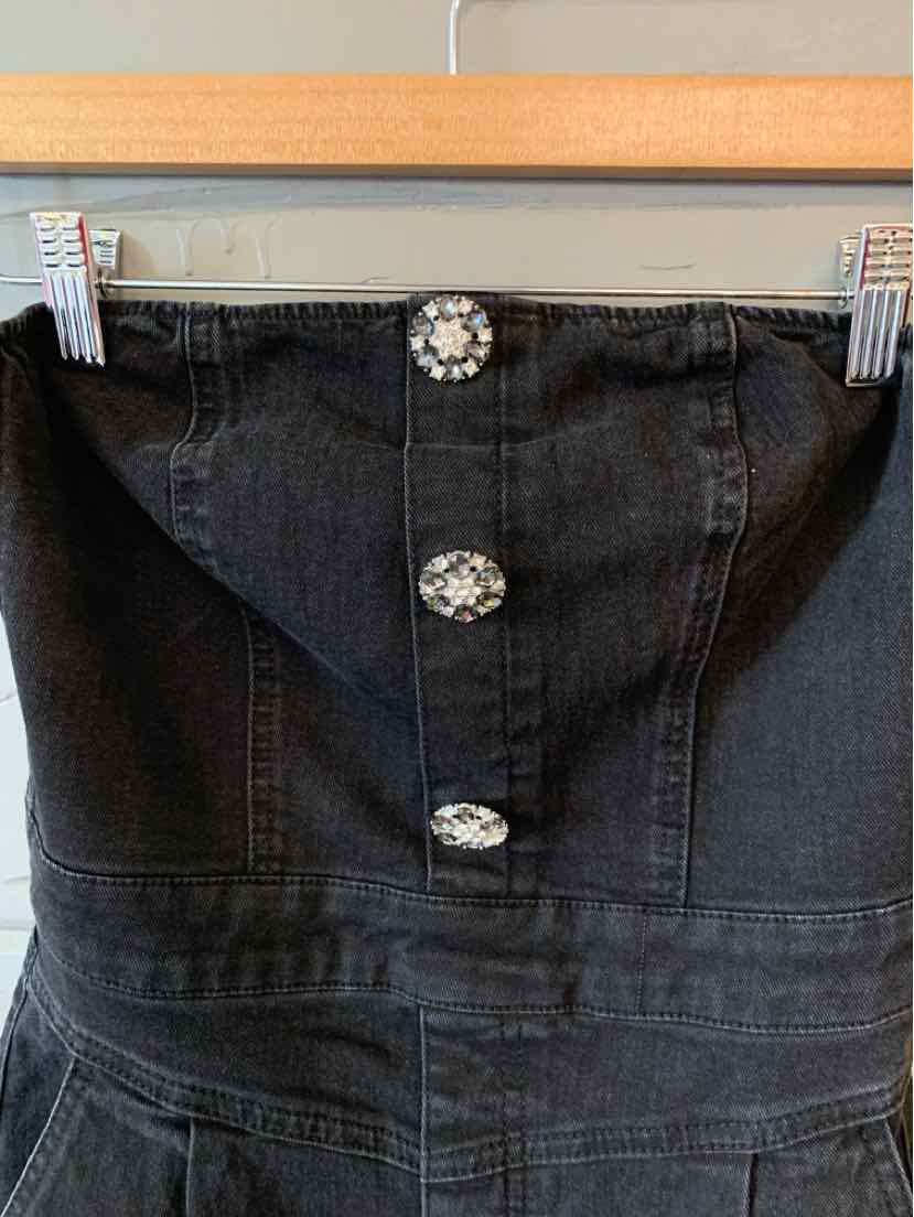 Black denim strapless dress with three large decorative silver buttons down the front.