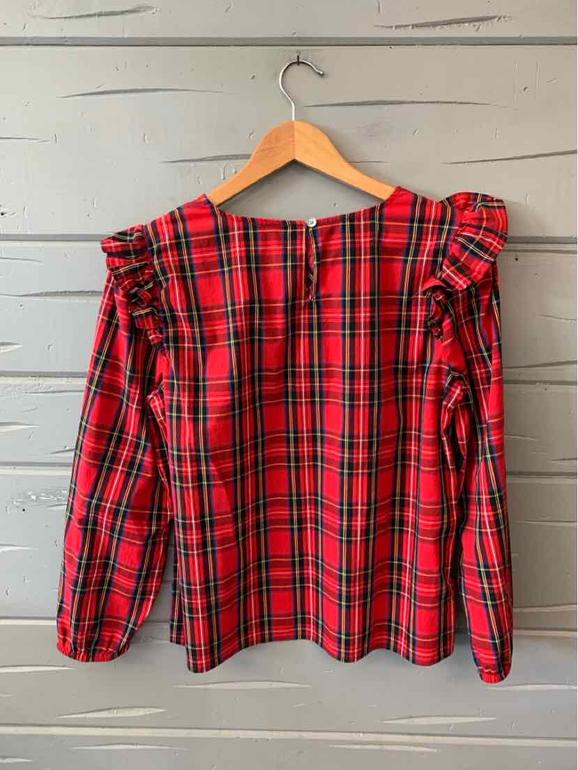 Red plaid long-sleeve blouse with ruffled shoulder details and a back zipper closure.