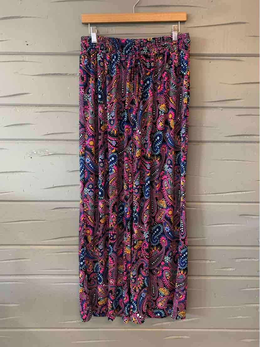 Long wide-leg pants with an elastic waistband, featuring a vibrant multicolor abstract floral pattern in shades of pink,.