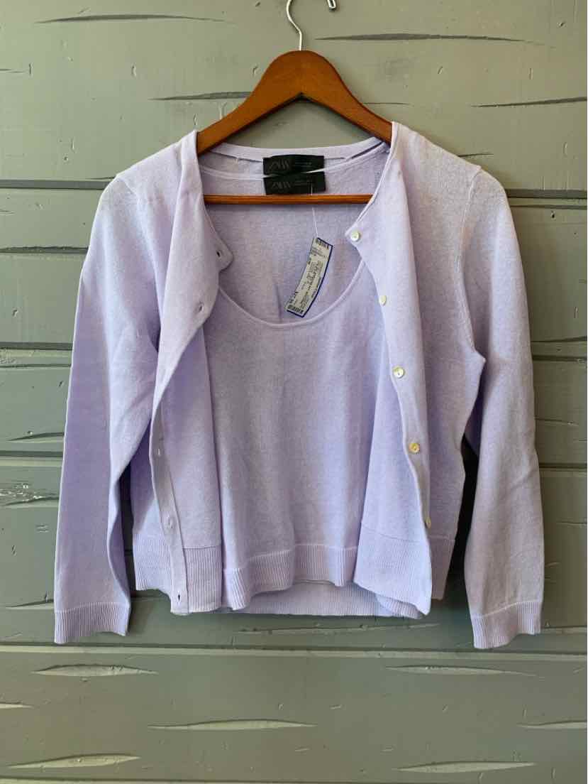 Light lavender knitted two-piece set with a button-up cardigan and matching sleeveless top.