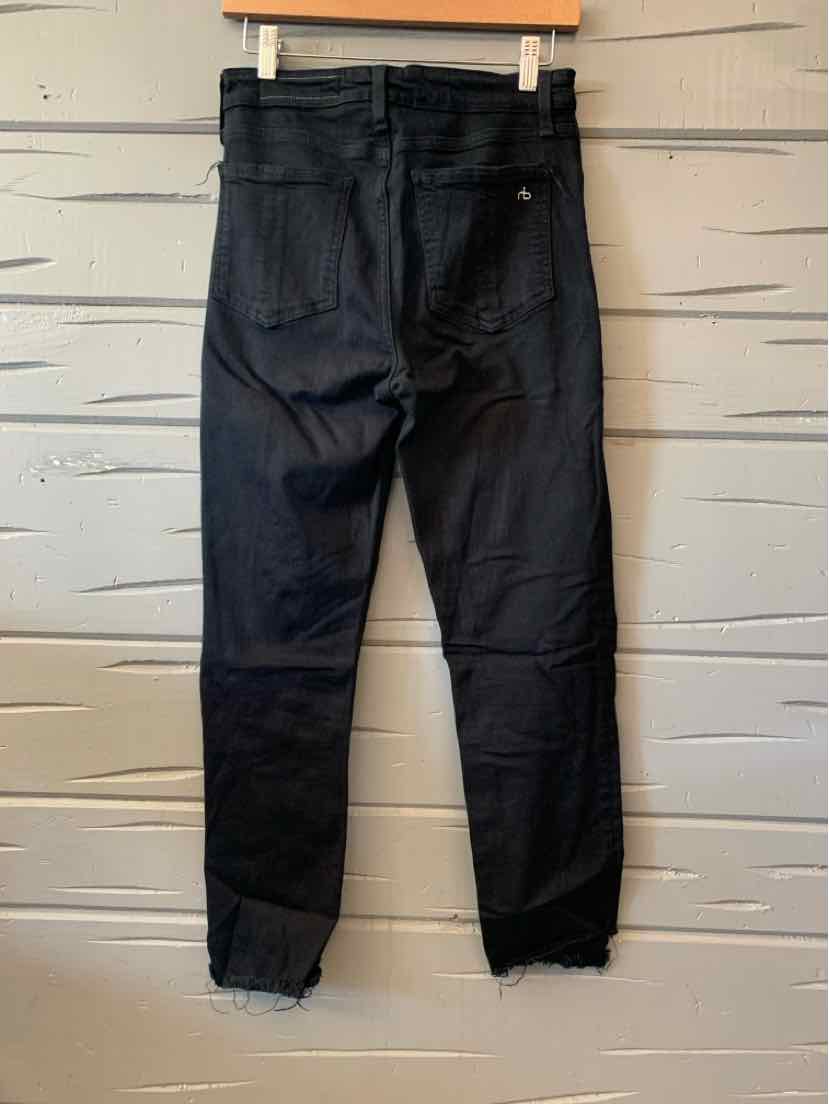 Black denim jeans with a high waist and frayed hems, styled for women's casual tops and fashion sneakers.