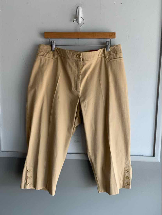 Tan cropped pants with front pockets and button detailing on hem, size 16WP.