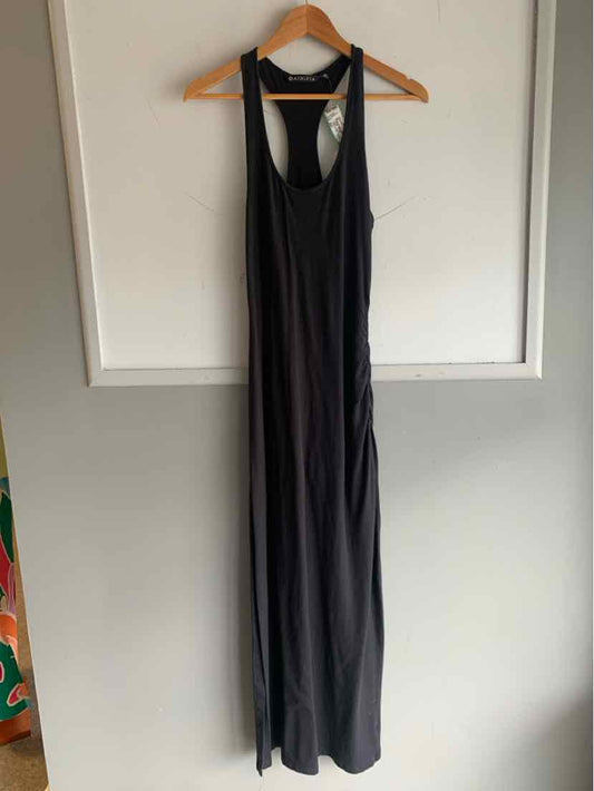 Black sleeveless jumpsuit with racerback and wide leg, lightweight fabric.