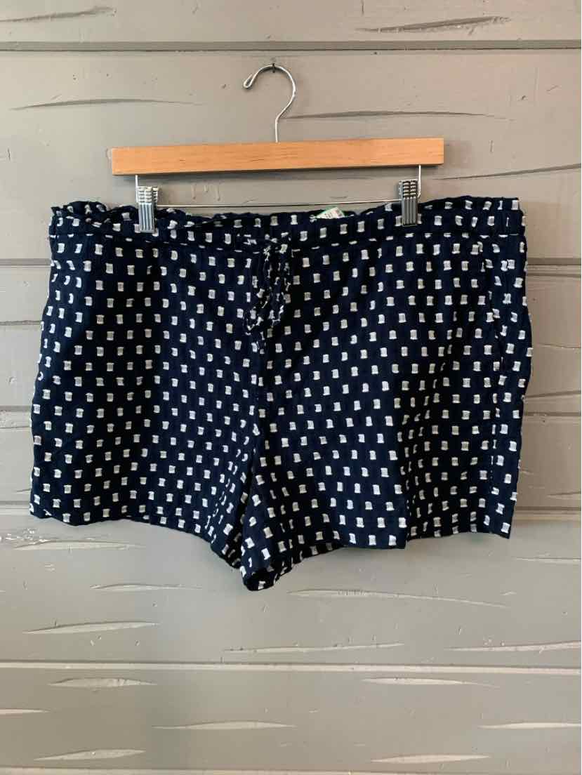 Navy blue shorts with white square pattern, mid-rise waist, and tailored fit.
