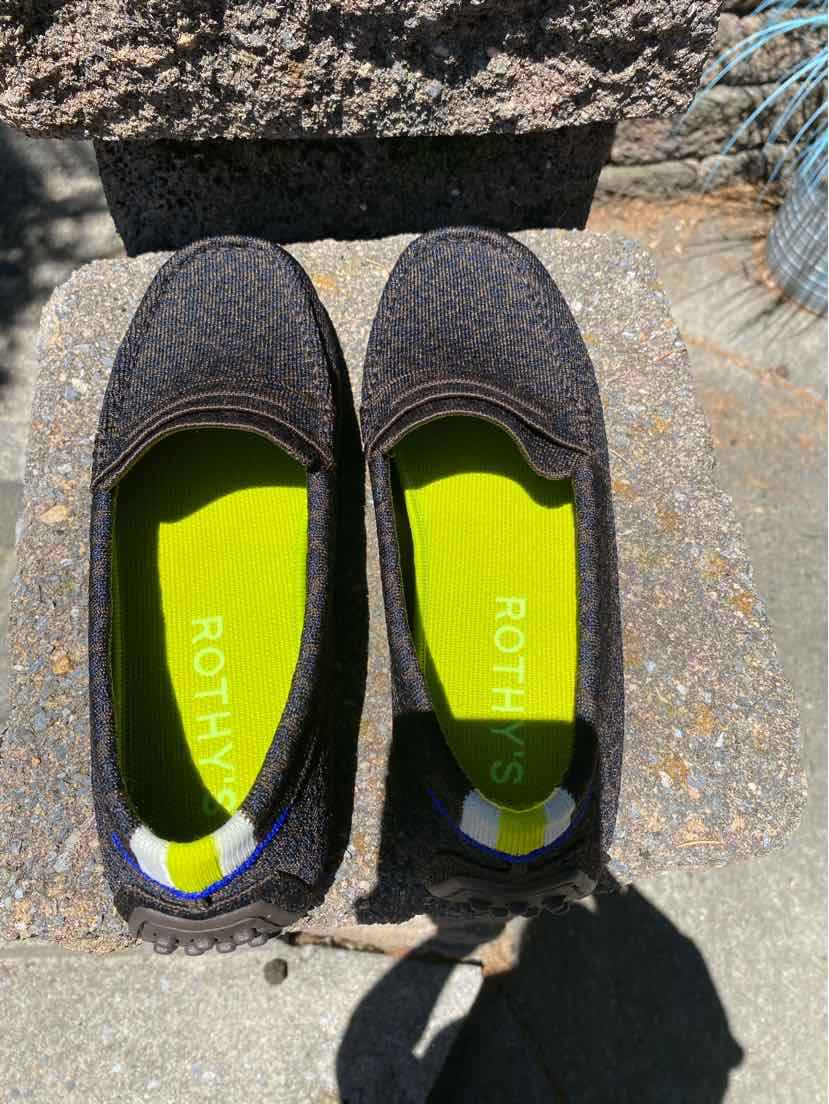 Womens size 10.5 flat shoe with brown cheetah print and lime green insole by Rothy's.