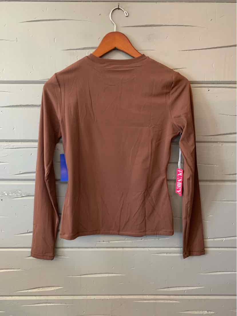 Brown long-sleeve fitted shirt with crew neck on wooden hanger against wood panel background.