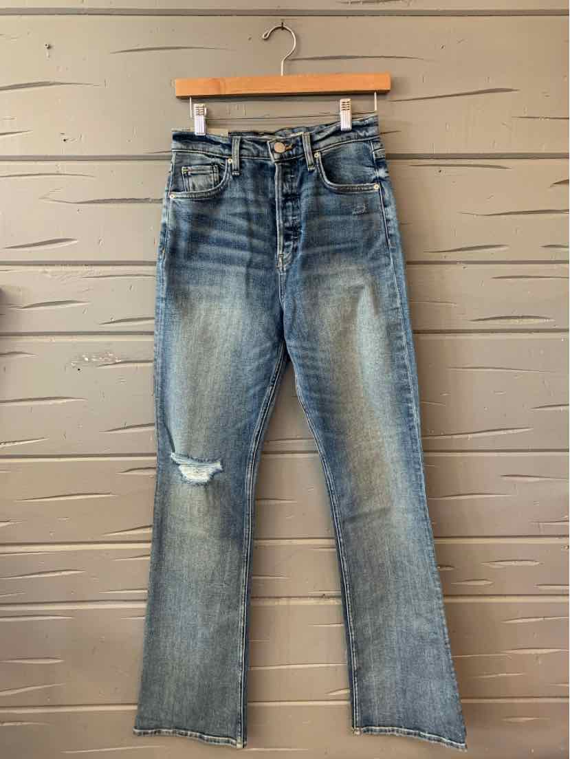 Blue distressed denim jeans with a frayed tear on the left knee and a classic five-pocket design.