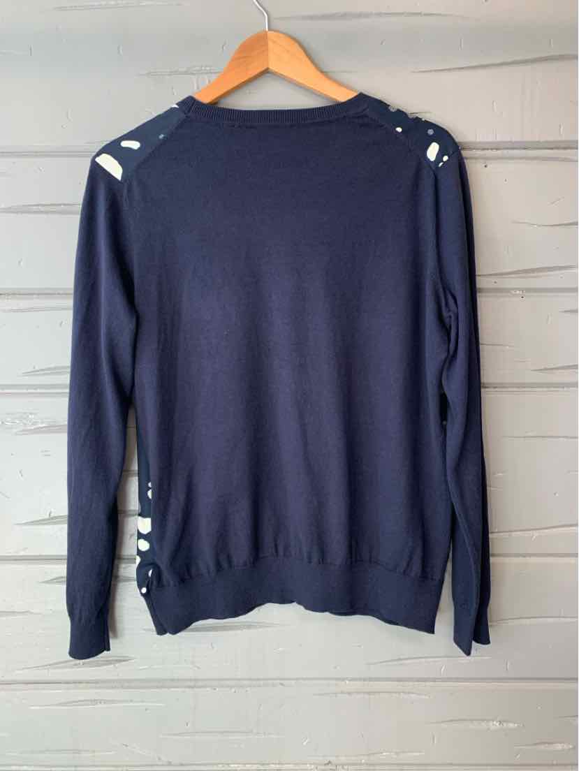 Navy blue long-sleeve sweater with button details on shoulders and sides, hanging on wooden hanger.