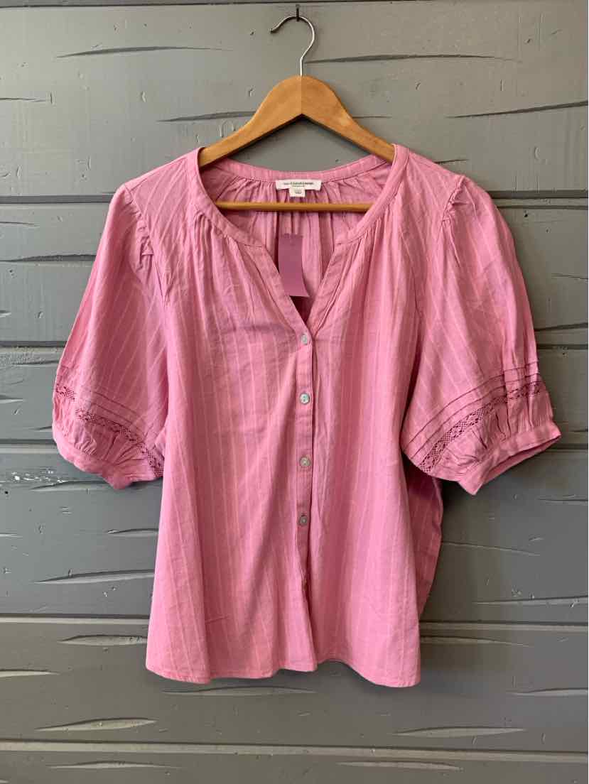 Pink short-sleeve blouse with round neckline, front button placket, and textured fabric.