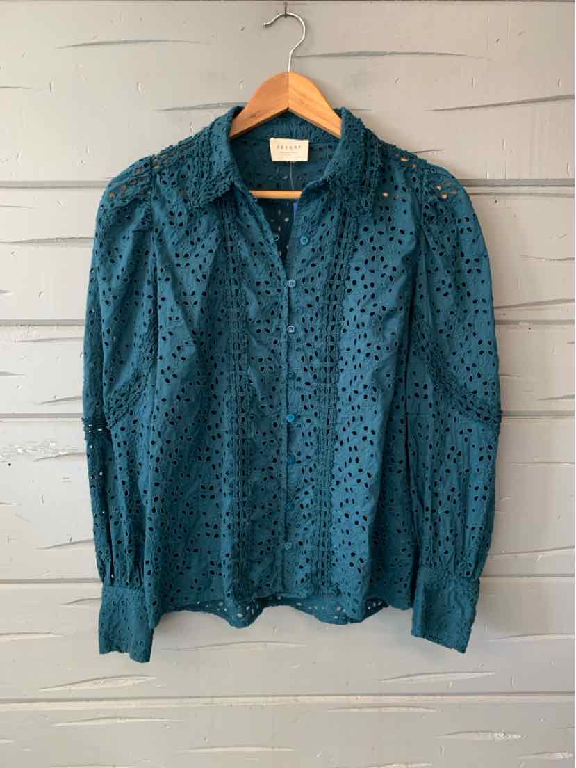 Teal long-sleeve blouse with a small dark floral print, gathered shoulders, and button-front closure.