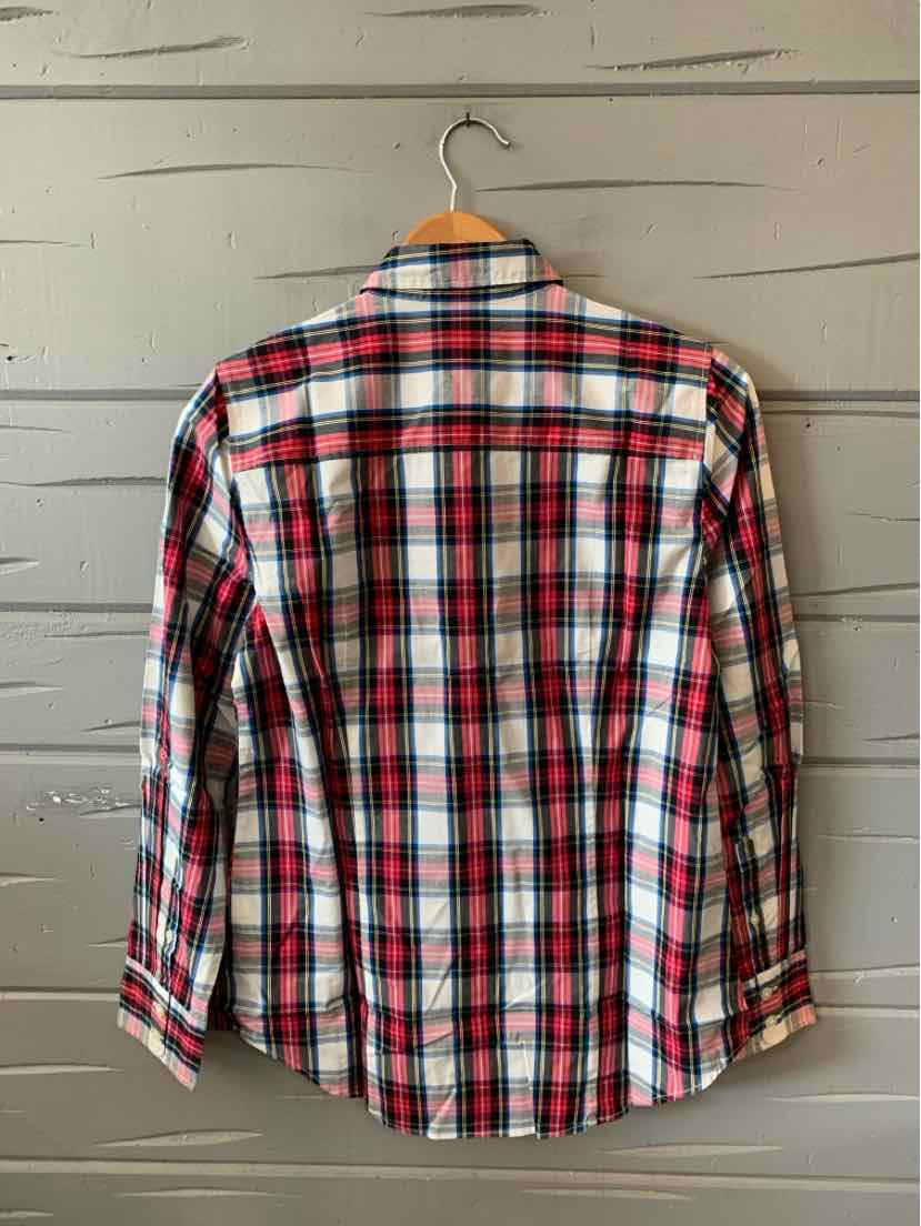 Red, white, and black plaid long-sleeve shirt with buttoned cuffs, classic fit, hanging on wooden hanger.