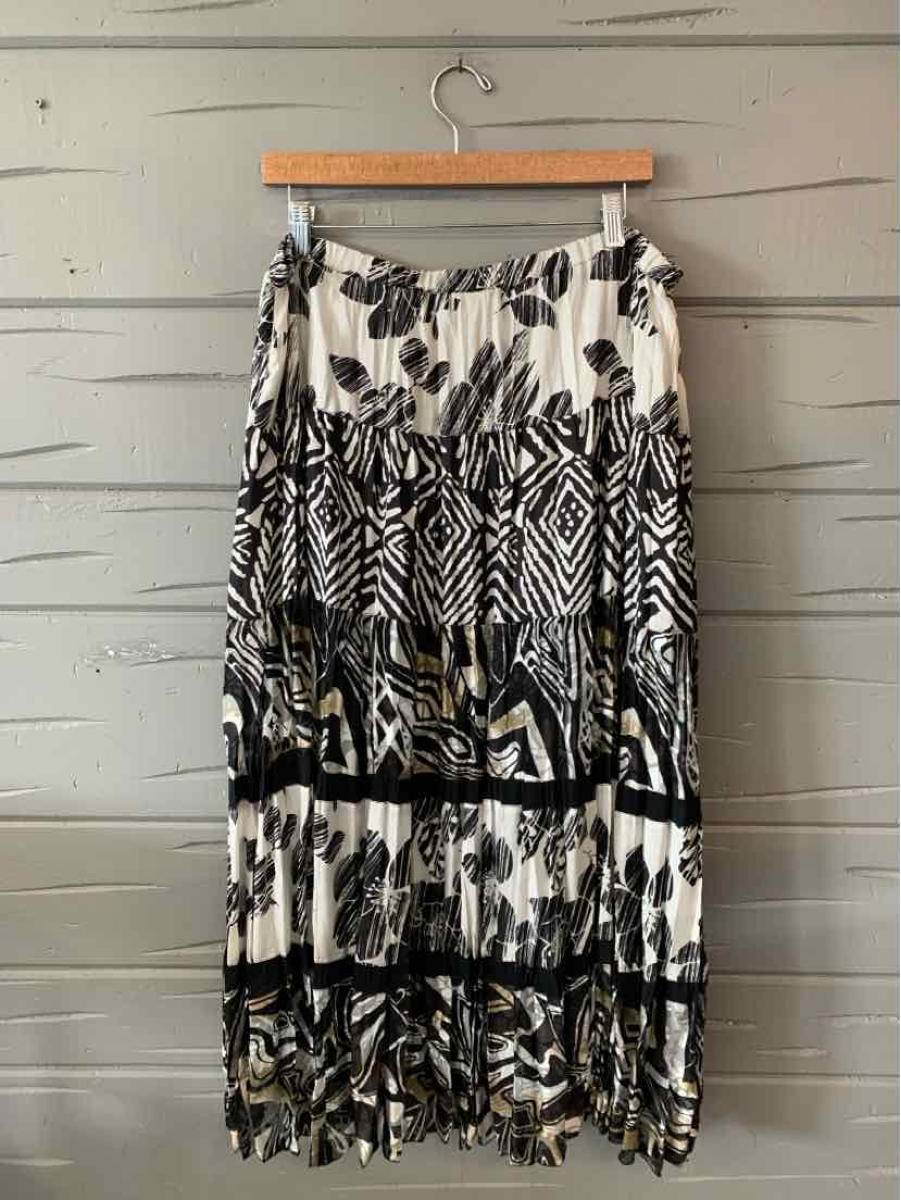 Black and white floral and geometric patterned maxi skirt with tiered ruffle hem.