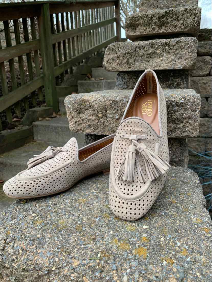 Beige perforated leather loafers with tassels and rounded toes, size 7, by Franco Sarto.