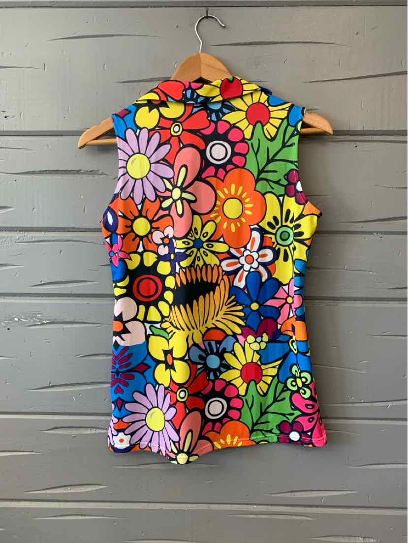 Sleeveless floral top with colorful large flowers in red, yellow, purple, and blue on a multicolor background.
