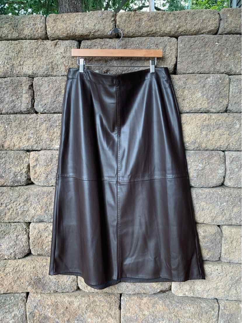 Black faux leather midi skirt with A-line shape and stitched panel detailing.