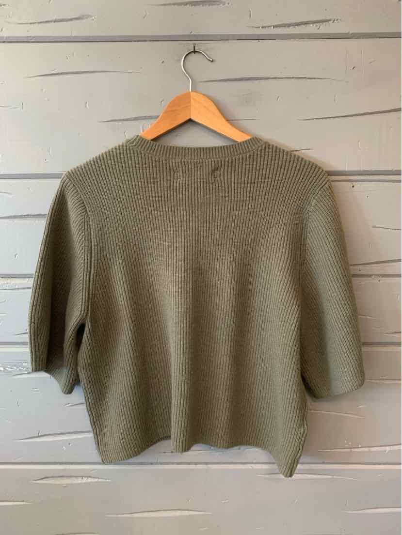 Olive green knit cropped sweater with three-quarter sleeves on wooden hanger.