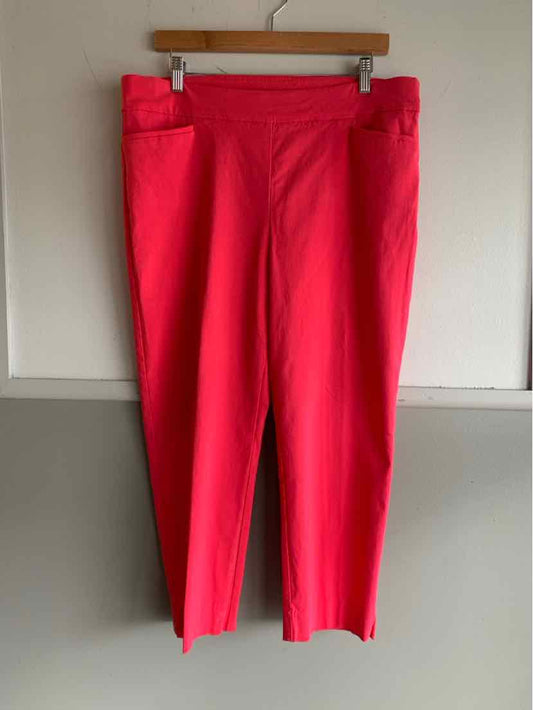 Bright red cropped pants with a flat front and side seam pockets, size 14.