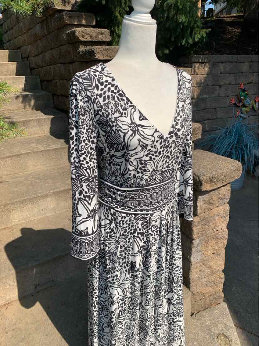 Black and white floral wrap dress with three-quarter sleeves and v-neckline in size 16.