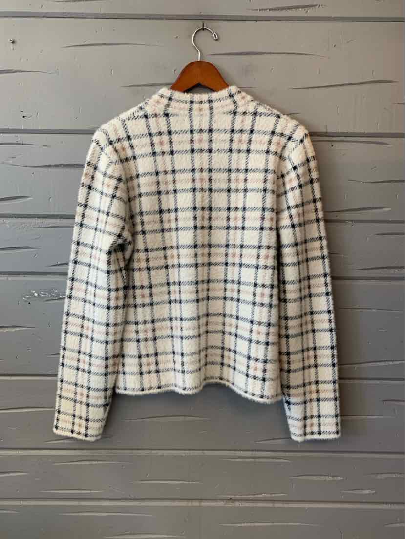 White long-sleeve blouse with black and beige plaid pattern and a rounded neckline.