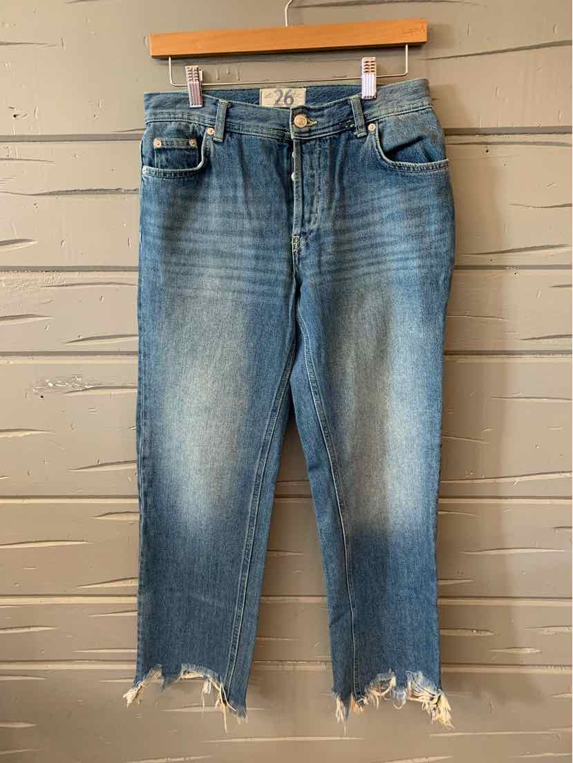 Light wash denim jeans with frayed hems and classic five-pocket design.