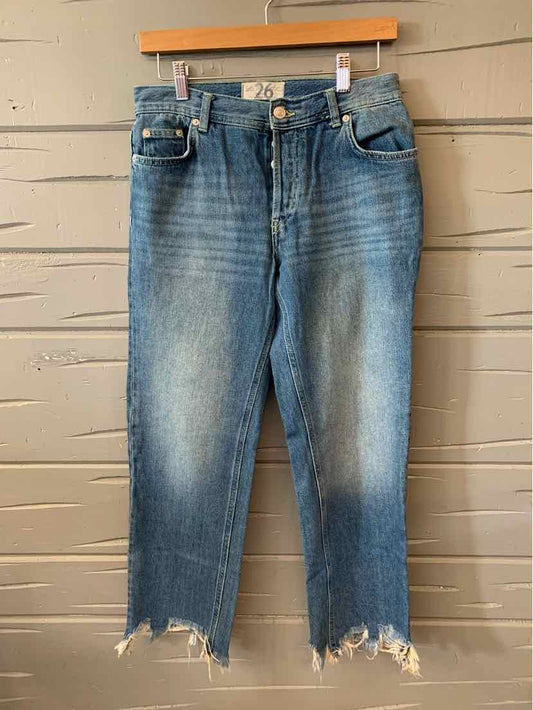 Light wash denim jeans with frayed hems and classic five-pocket design.