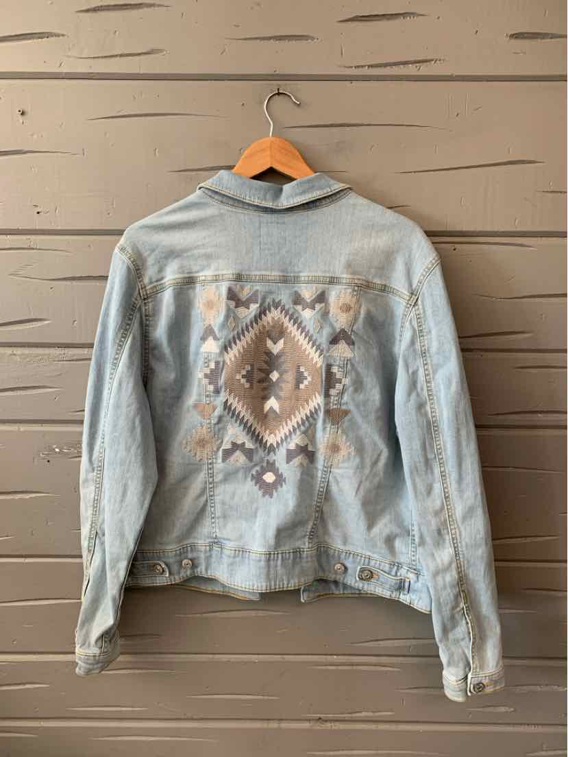 Light blue denim jacket with Southwestern-inspired embroidered diamond pattern on the back.