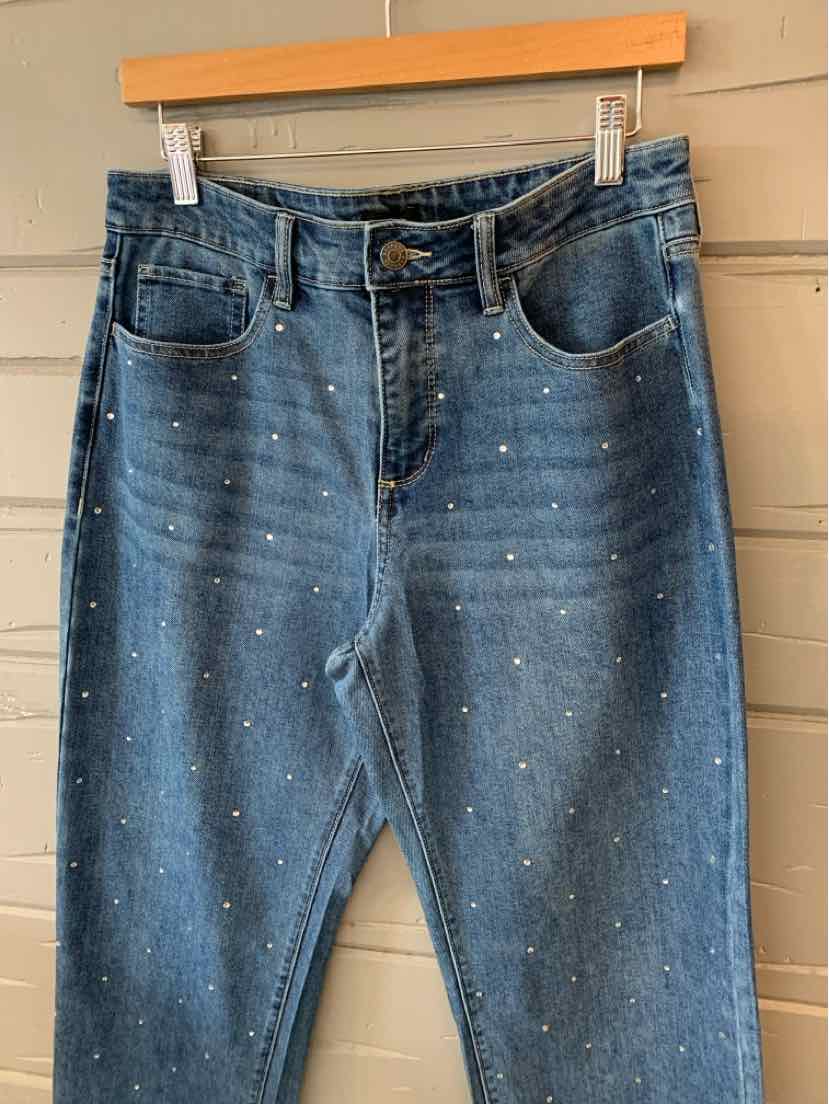 Blue denim jeans with high waist and small white paint splatter accents, size 4.