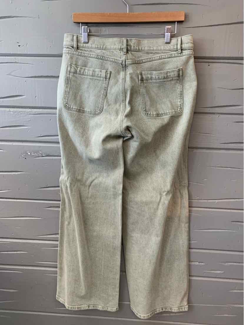 Light olive green straight-leg pants with back pockets and visible stitching hanging on wooden hanger.