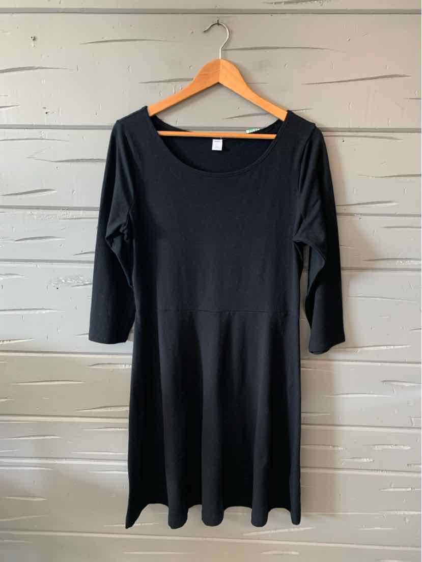 Black cotton blend dress with three-quarter sleeves and a scoop neckline, knee-length.