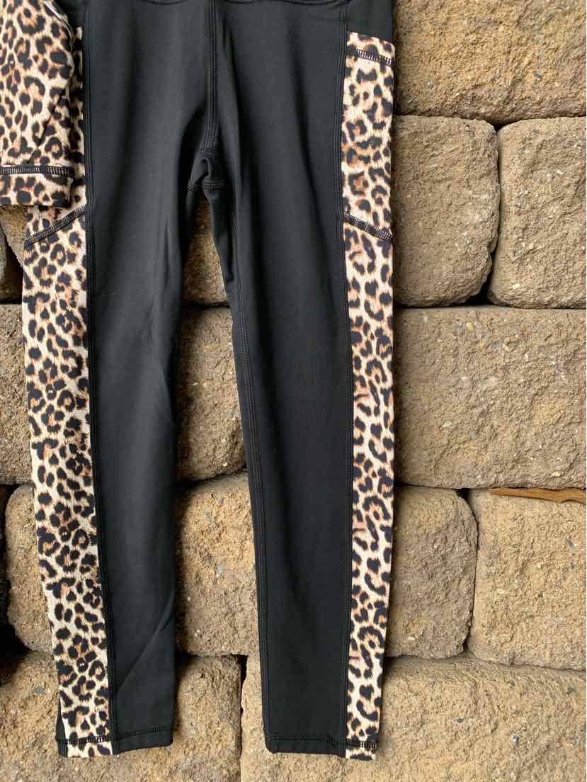 Black leggings with leopard print side panels and a high waistband.