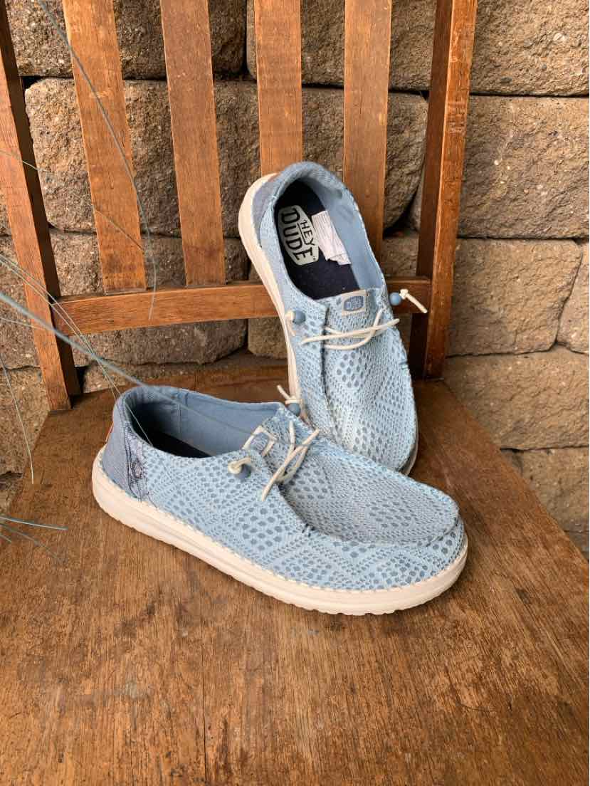Light blue woven fabric casual shoes with white soles and beige laces, slip-on design.