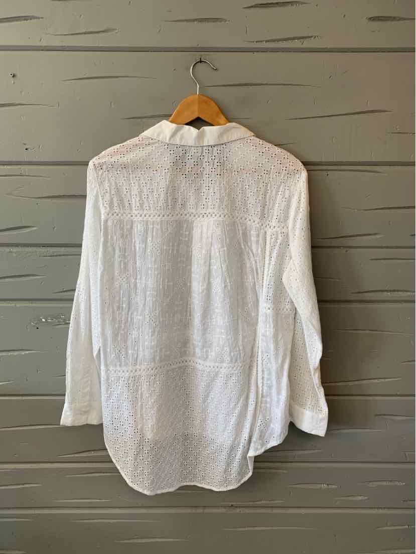 White long-sleeve button-up shirt with subtle textured pattern, classic collar, and relaxed fit.