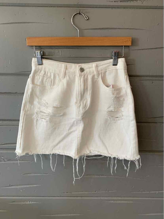 White distressed denim mini skirt with frayed hem and front pockets, size small.