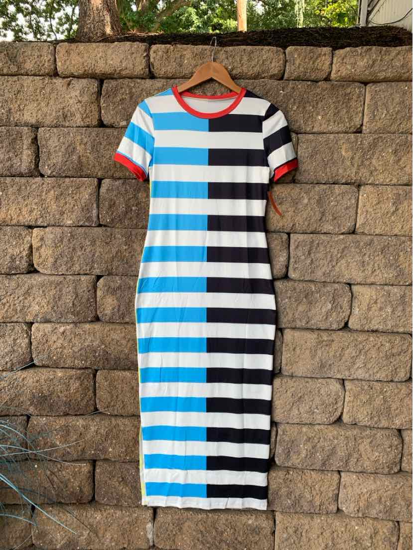 Mid-length knit dress with bold vertical stripes in blue, black, and white, featuring rust-orange trim on round neckline and