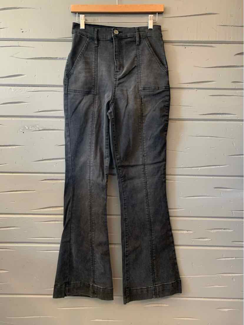 Black denim jeans with a slight flare and front pockets for women's casual tops and activewear clothing styles.