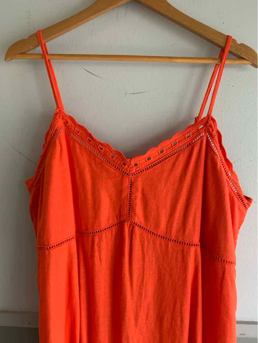Bright orange sleeveless dress with thin spaghetti straps and scalloped lace trim along the neckline.