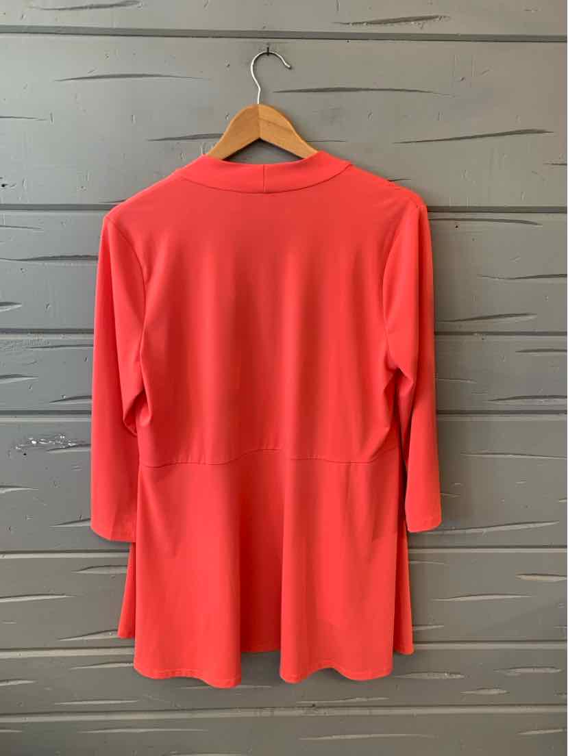 Coral long-sleeve tunic with crew neckline and solid color, medium size, relaxed fit.