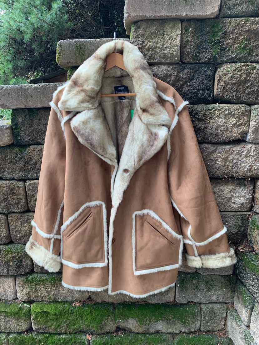 Tan shearling coat with cream fur trim on collar, cuffs, and pockets, oversized fit size 3X.