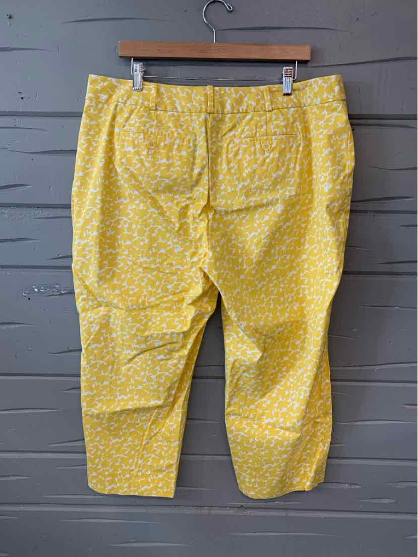 Yellow floral capri pants with tailored pockets and belt loops, size 16P.