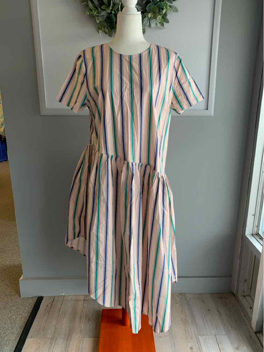 Midi dress with vertical pink and green stripes, short sleeves, and gathered waist on mannequin.